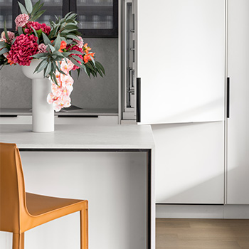 white island bench with waterfall, vase of flowers