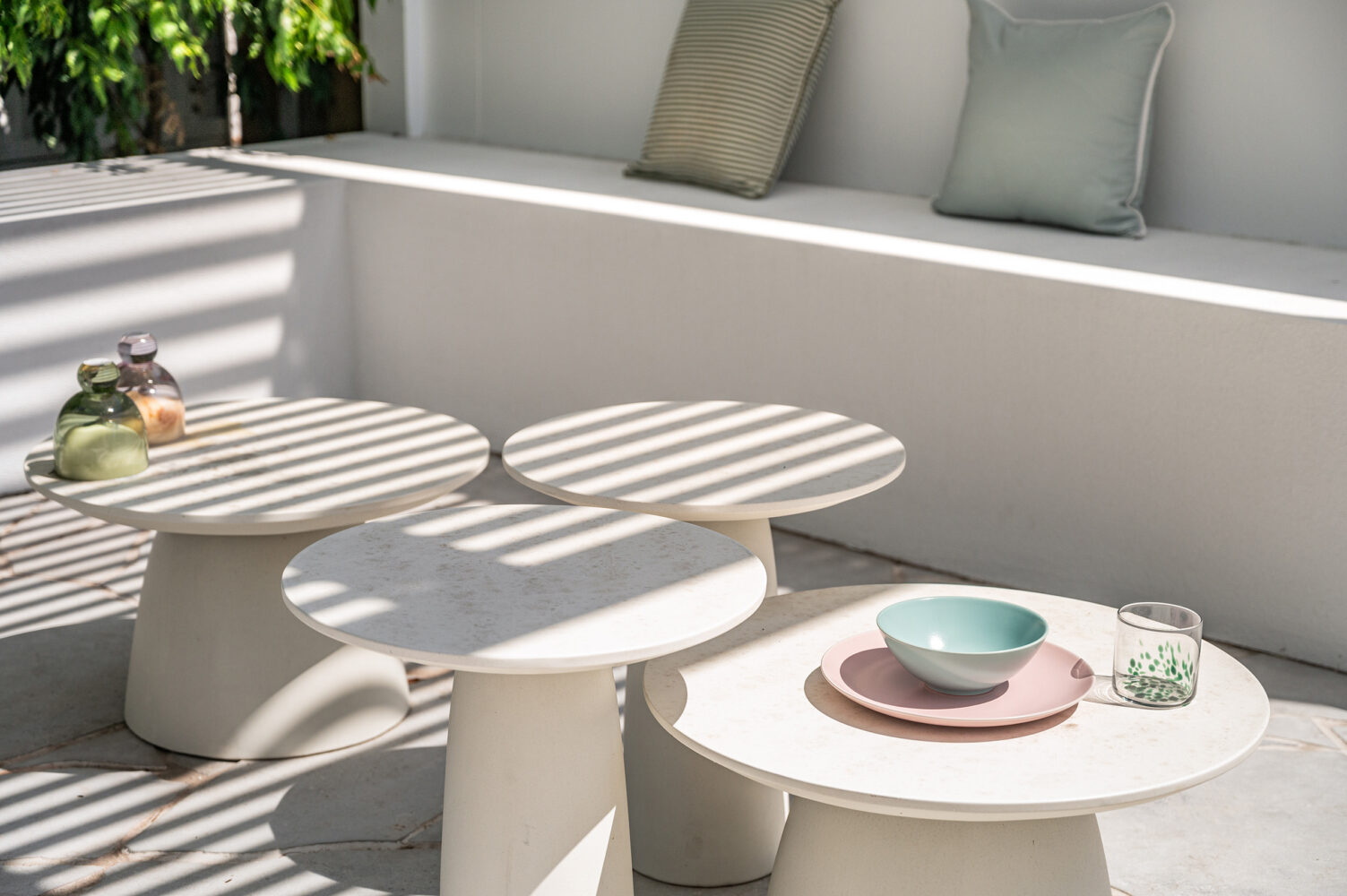 palm springs style patio with furniture and place settings