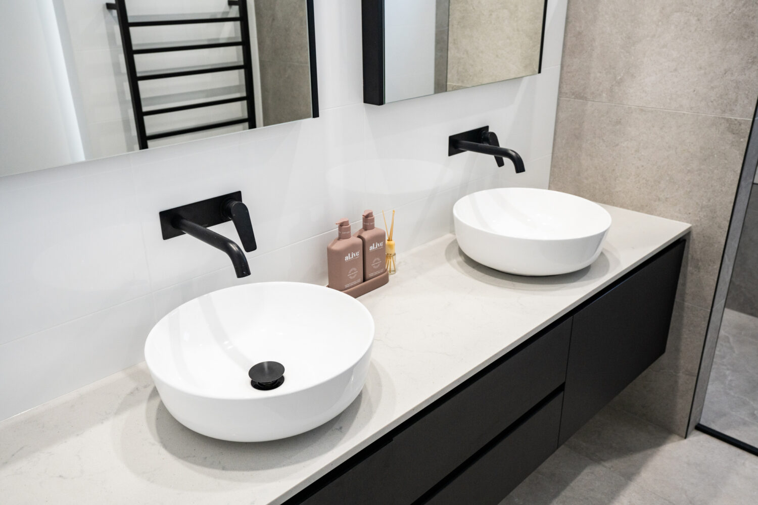 double vanity with white sinks and black tapware